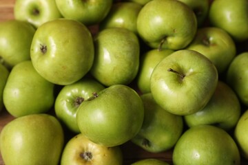 Fresh ripe green apples as background, closeup