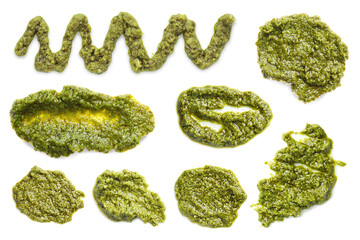 Set of fresh pesto sauce isolated on white, top view