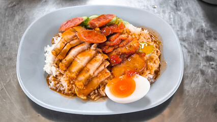 Crispy pork rice on a blue plate on the dining table