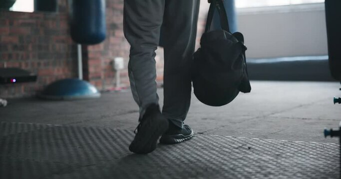 Legs, fitness and walking to gym with bag to start exercise, workout and muscle for wellness. Sport, shoes and person at health club with gear for training athlete ready for practice in back view