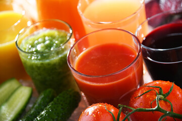 Glasses with fresh organic vegetable and fruit juices