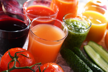 Glasses with fresh organic vegetable and fruit juices
