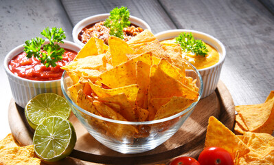 Composition with bowl of tortilla chips.