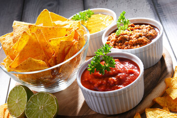 Composition with bowl of tortilla chips.