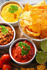 Composition with bowl of tortilla chips.