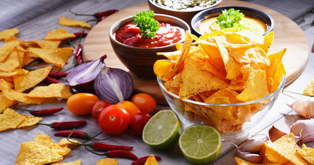 Composition with bowl of potato chips.