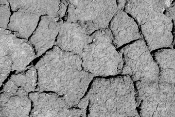 Wall texture soil dry crack pattern of drought lack of water of nature brown old broken background.