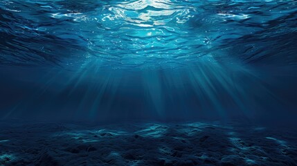 Dark blue ocean surface seen from underwater. Illustration of sun light rays under water. The relief of the seabed through the water column. Design for banner, poster, cover, brochure or presentation