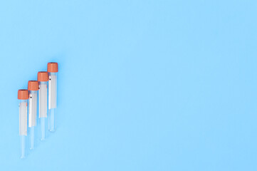 Red test tubes on blue background