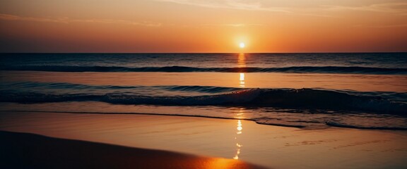 Naklejka premium Sunset over a serene beach with