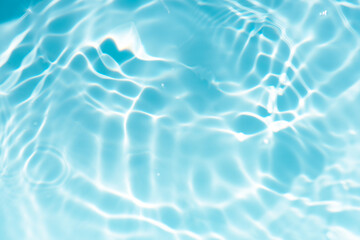 Blue water with ripples on the surface. Defocus blurred transparent blue colored clear calm water...