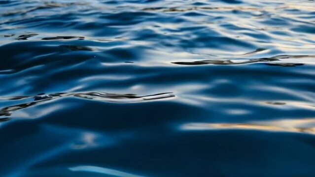 calm blue sea water, calm waves in the ocean. seamless looping overlay 4k virtual video animation background