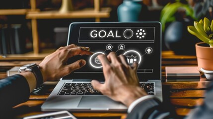 a businessman's is using a laptop and touching virtual icons of sales performance, for a marketing plan or business growth, text "GOAL"