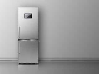 Modern fridge in front of grey wall.