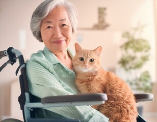 猫を抱く車椅子のシニア女性