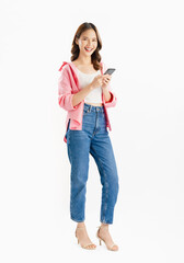 Beautiful Asian woman wear an pink shirt and holding smartphone and smiling on white background.