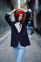 Fashion woman portrait walking tourist in stylish clothes with red lips walking down narrow city...