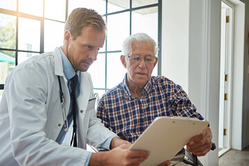 Doctor, man and wheelchair with clipboard in clinic for consultation, report or medical review....