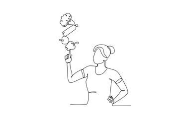 Single continuous line drawing of a Woman planting fruit in her hands, world vegetarian day concept. One line draw design vector illustration
