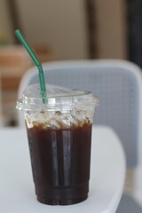 plastic cup coffee with a green straw