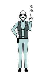 Senior female engineer in helmet and work wear coming up with an idea.