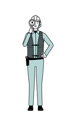 Senior female engineer in helmet and work wear looking through magnifying glasses