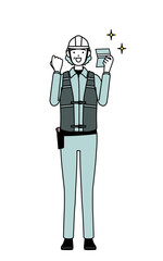 Senior female engineer in helmet and work wear who is pleased to see a bankbook.