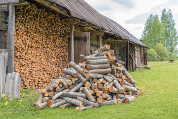 wood pile near an old barn