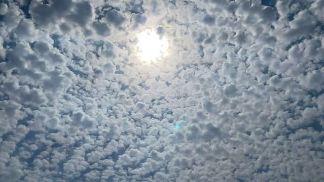 Clouds Time Lapse, moving softly on the sky and the sun shining.