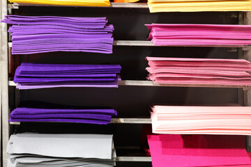 Shelves with colorful fabric and felt pieces for DIY crafts for sale in the hobby shop