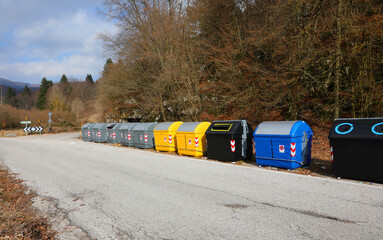 Row of recycling bins on the curbside