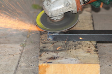 metal repair work with a grinder with beautiful sparks
