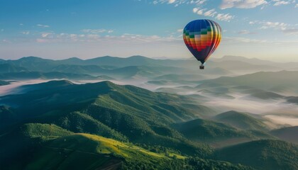 Naklejka premium Floating Above the Mountains: A Vibrant Hot Air Balloon Journey