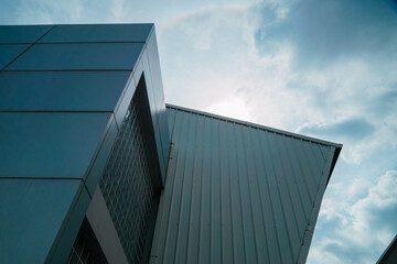 A building with a roof that is slanted and has a lot of windows