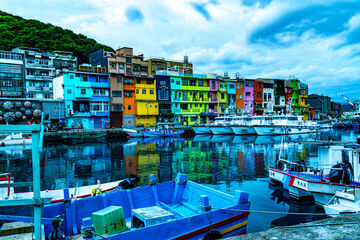 A colorful row of buildings line the water's edge