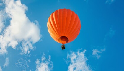 Vibrant Orange Hot Air Balloon Soaring in the Blue Skies of Amersfoort, The Netherlands