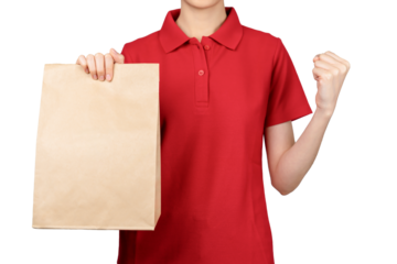 Woman employee in red shirt uniform holding craft paper package isolated on gray background.