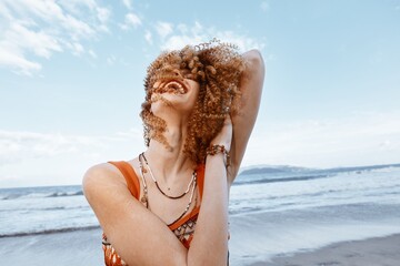Beach Woman: Smiling Traveler in Hippie Lifestyle, Embracing Freedom and Nature