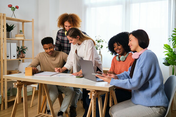 Group of multiethnic college students studying together at home.