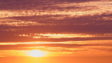 Fototapeta premium Sunset is a beautiful view of the horizon, when the sunlight gives way to a colorful dusk with red clouds.