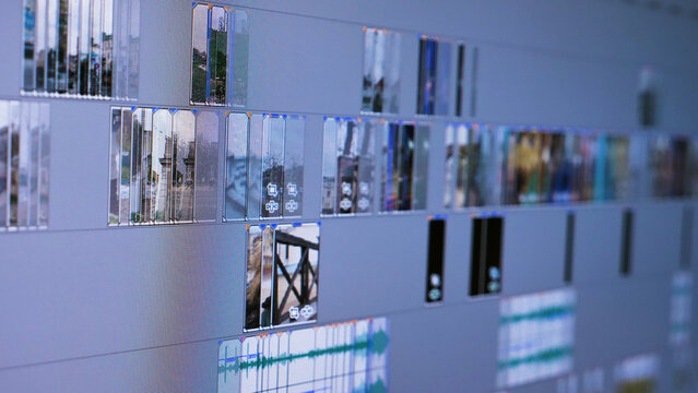 A close-up of a video editing software interface on a computer screen, showcasing a timeline with multiple video and audio tracks. The focus is on timeline area, with some parts slightly blurred.