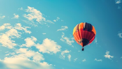 Obraz premium Feeling Lighter Than Air: A Balloon Soaring in the Blue Sky