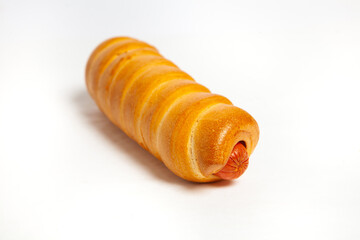 Sausage in the dough isolated on a white background.