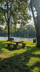 A serene lakeside picnic area with clearly marked recycling bins generated by AI