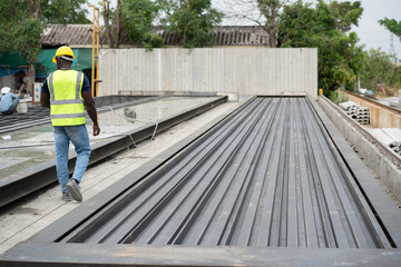Back African engineer man working with precast cement at precast cement outdoor factory	