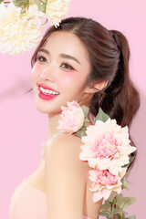 Pretty Asian beauty woman with Korean makeup glowing face and healthy facial skin portrait smile...