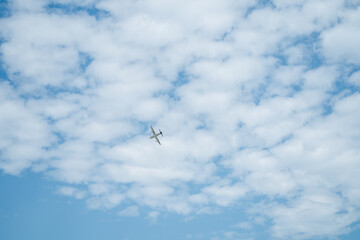flying object airplane helicopter flying in the blue sky at high speed, clear sky background