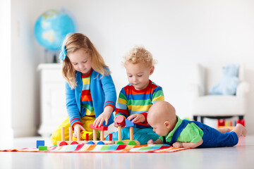 Kids playing with wooden toy train