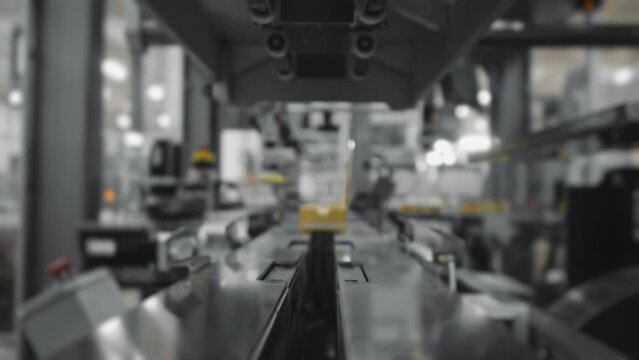 Robotic packaging line with automatic robot packer in industrial factory.