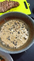 black beans with mushrooms and spices cooked for pasta sauce